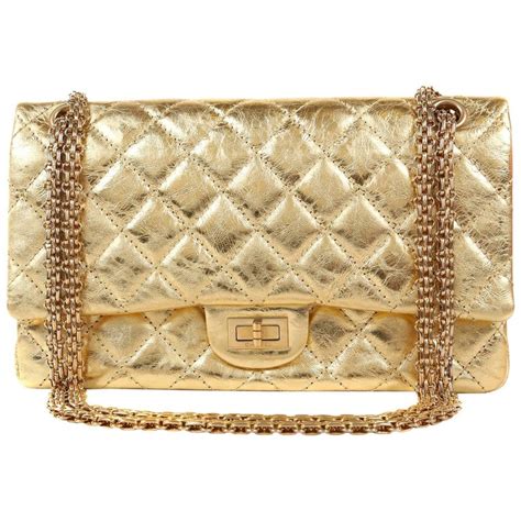 chanel bag with gold ribbon.